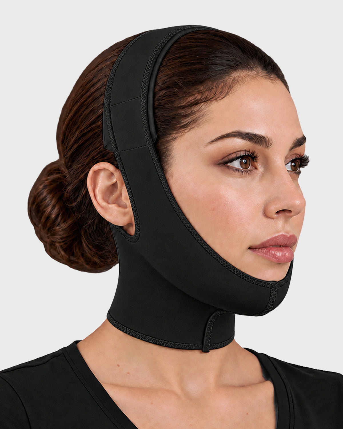 Front view of facial compression garment in black, showing contoured chin and cheek support fit