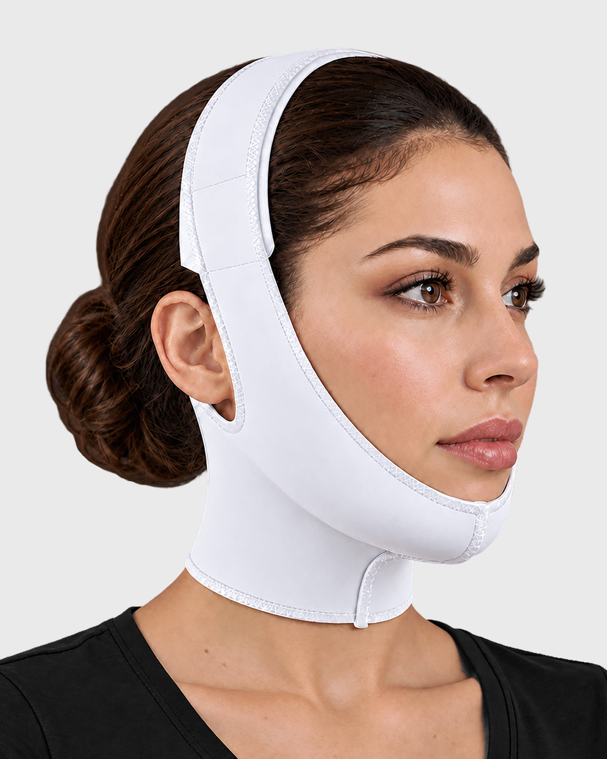 Front view of facial compression garment in white, showing contoured chin and cheek support fit