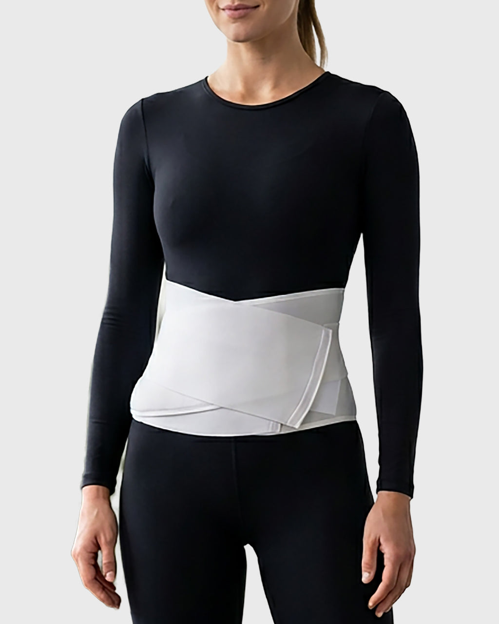 Front view of postpartum contoured abdominal binder featuring a padded support panel with cooling cut-out design for comfortable postpartum abdominal support and recovery.