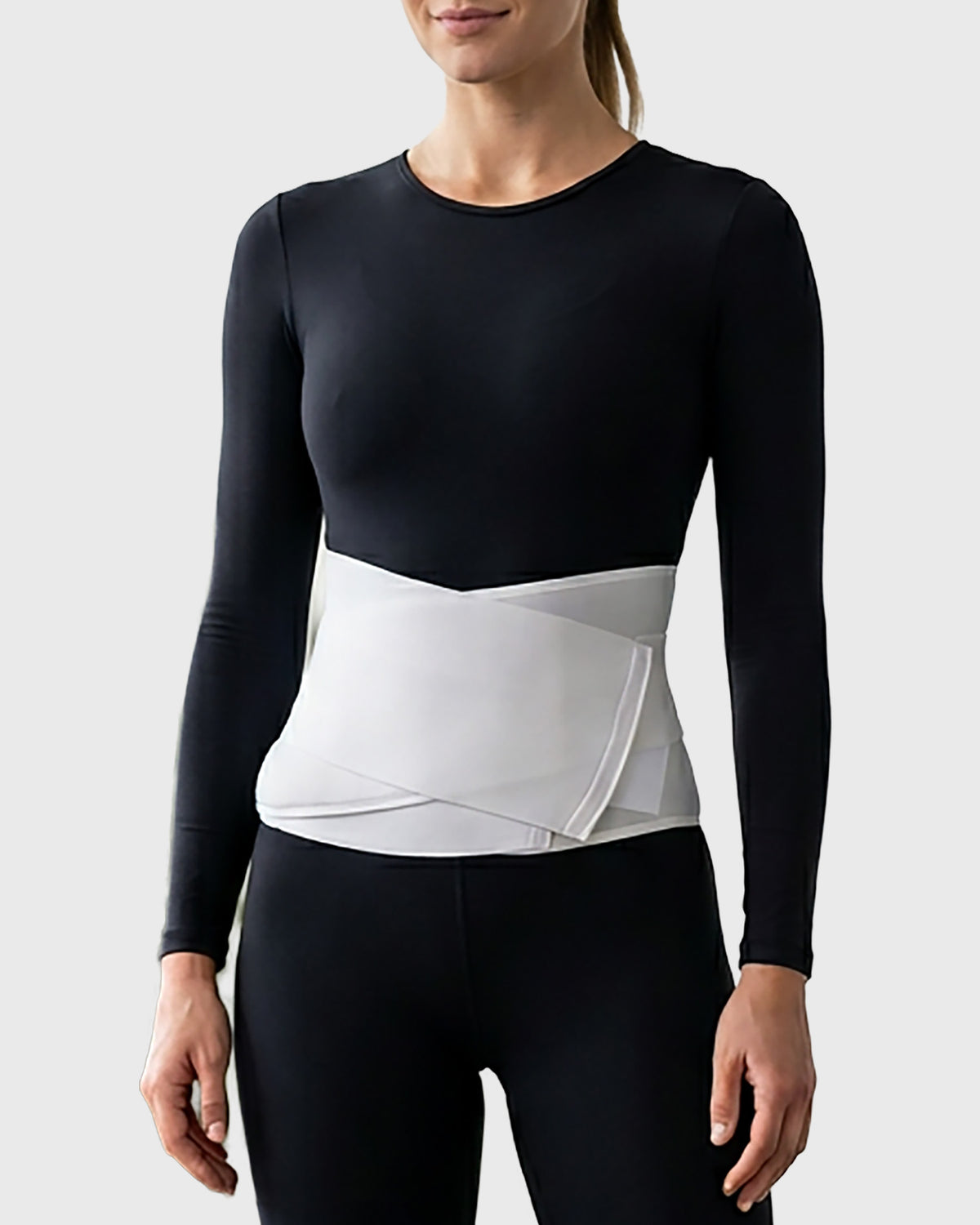 Front view of postpartum contoured abdominal binder featuring a padded support panel with cooling cut-out design for comfortable postpartum abdominal support and recovery.