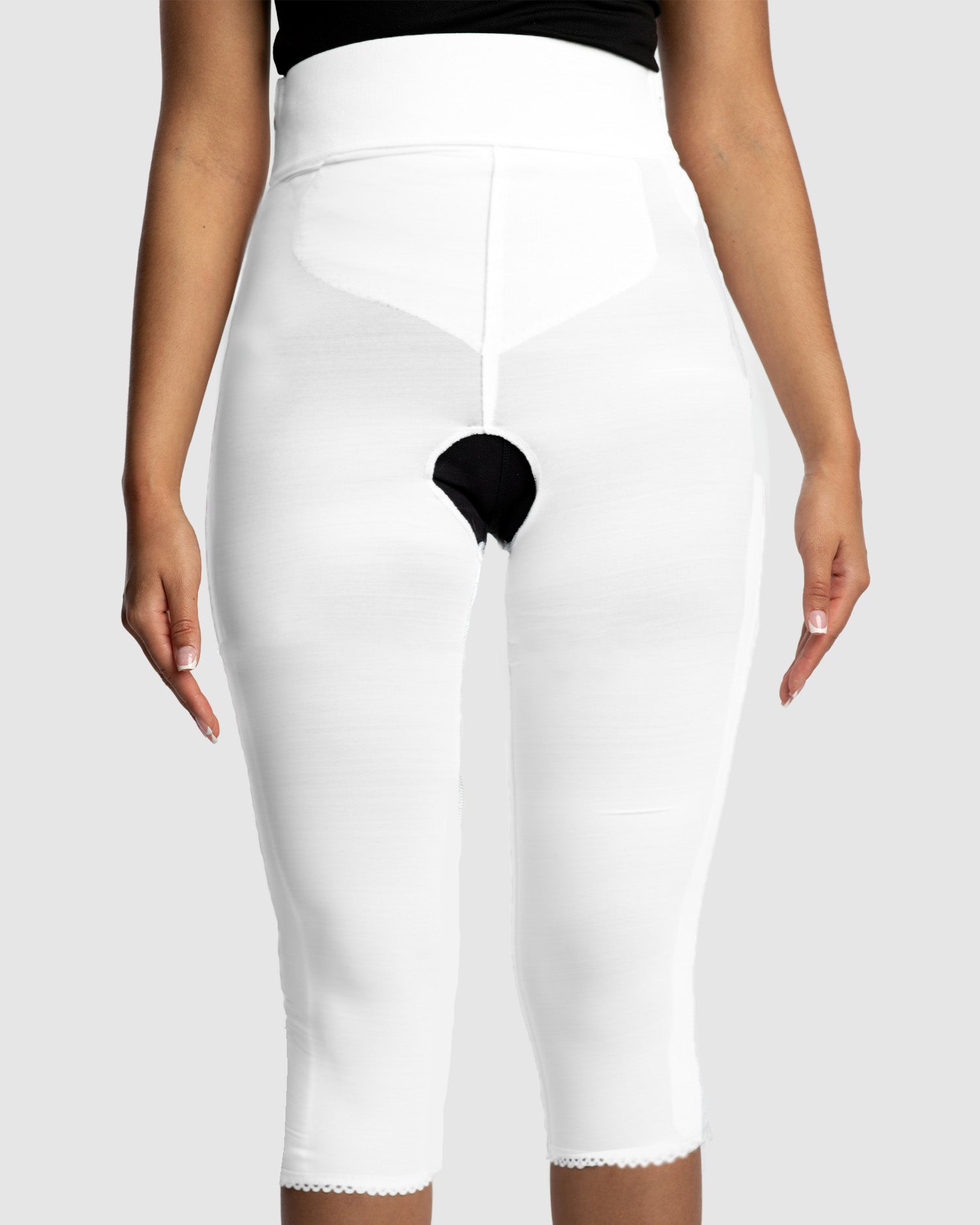 Front view of white below knee compression girdle with contact closure and front zipper for post-surgical recovery