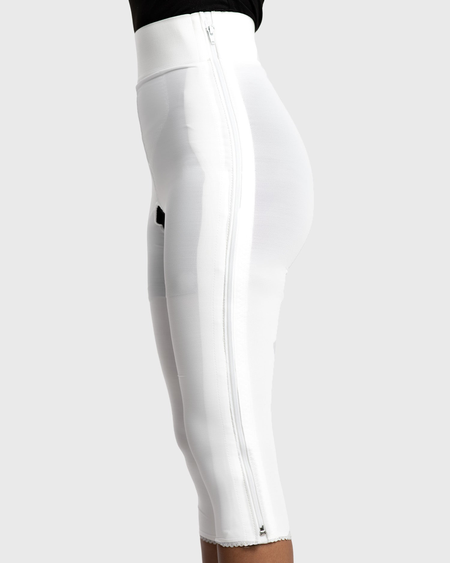 Side view of white below knee compression girdle with contact closure for leg recovery