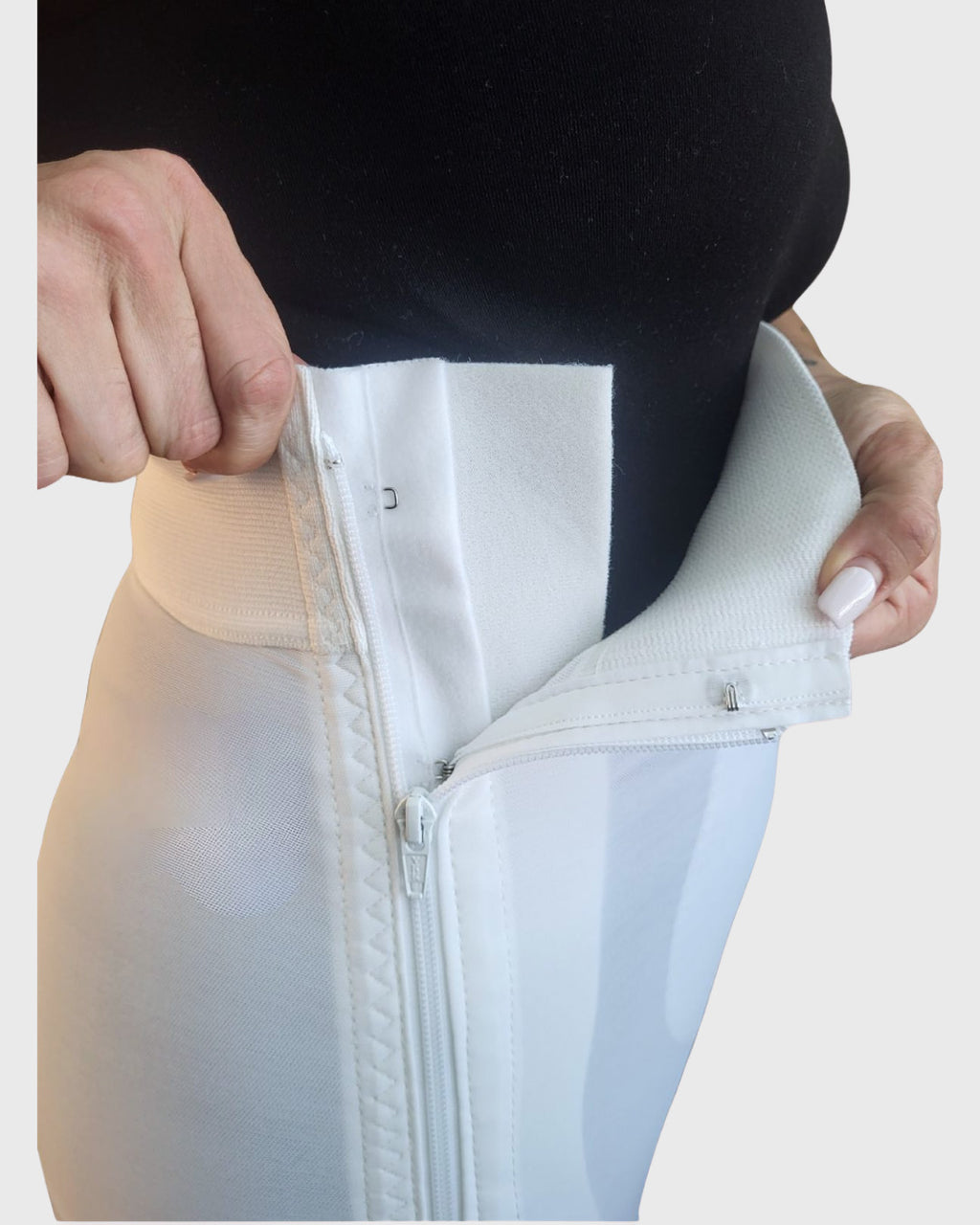 Side view of white high waist above knee compression girdle with hook and eye closure for torso and leg support