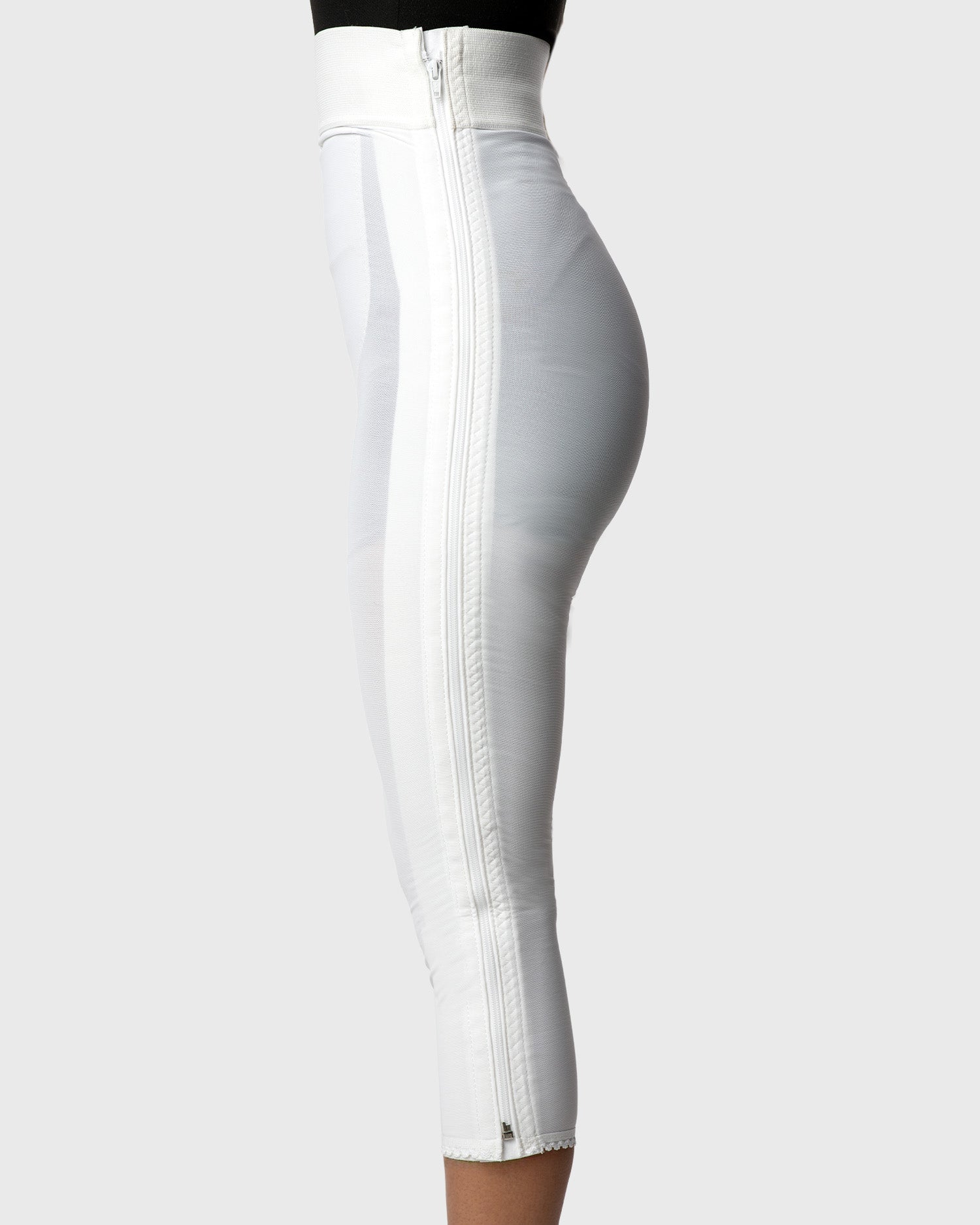 Side view of white high waist below knee compression girdle with hook and eye closure for extended compression