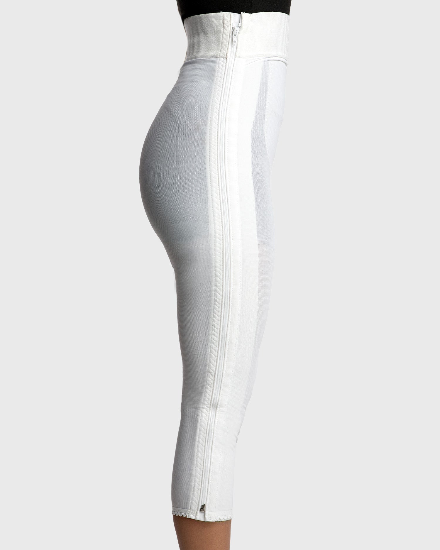 Side view of white high waist below knee compression girdle with hook and eye closure for extended compression