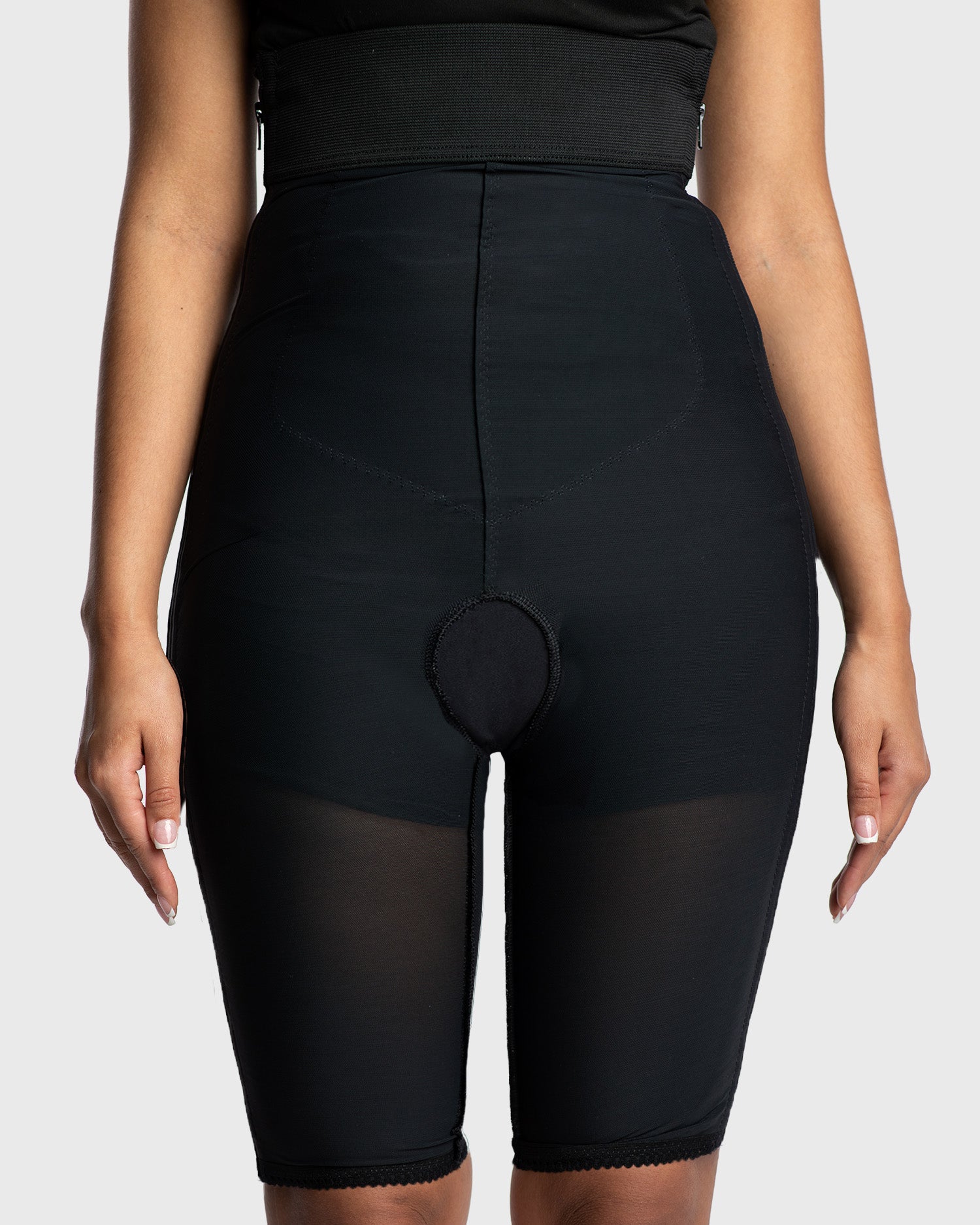 Front view of black high waist above knee compression girdle with hook and eye closure and front zipper for post-surgical recovery