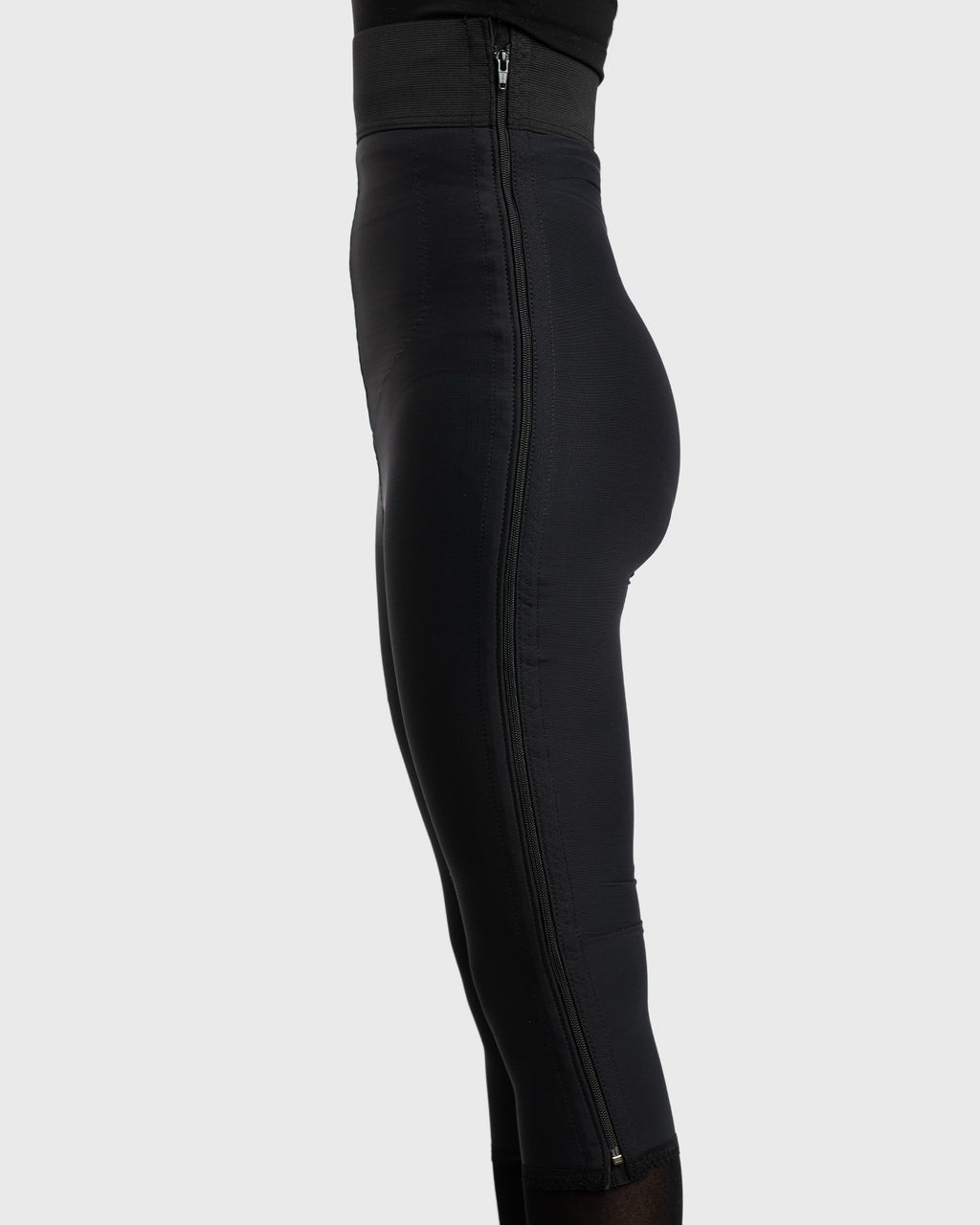 Side view of black high waist below knee compression girdle with hook and eye closure for post op support