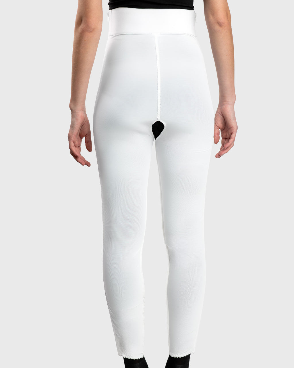 Rear view of white high waist ankle length compression girdle with hook and eye closure for post-op recovery