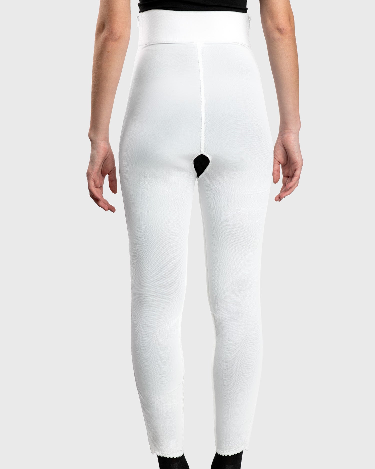 Rear view of white high waist ankle length compression girdle with hook and eye closure for post-op recovery