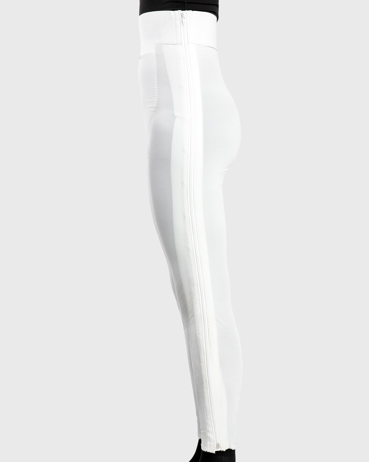 Side view of white high waist ankle length compression girdle with hook and eye closure for complete leg compression