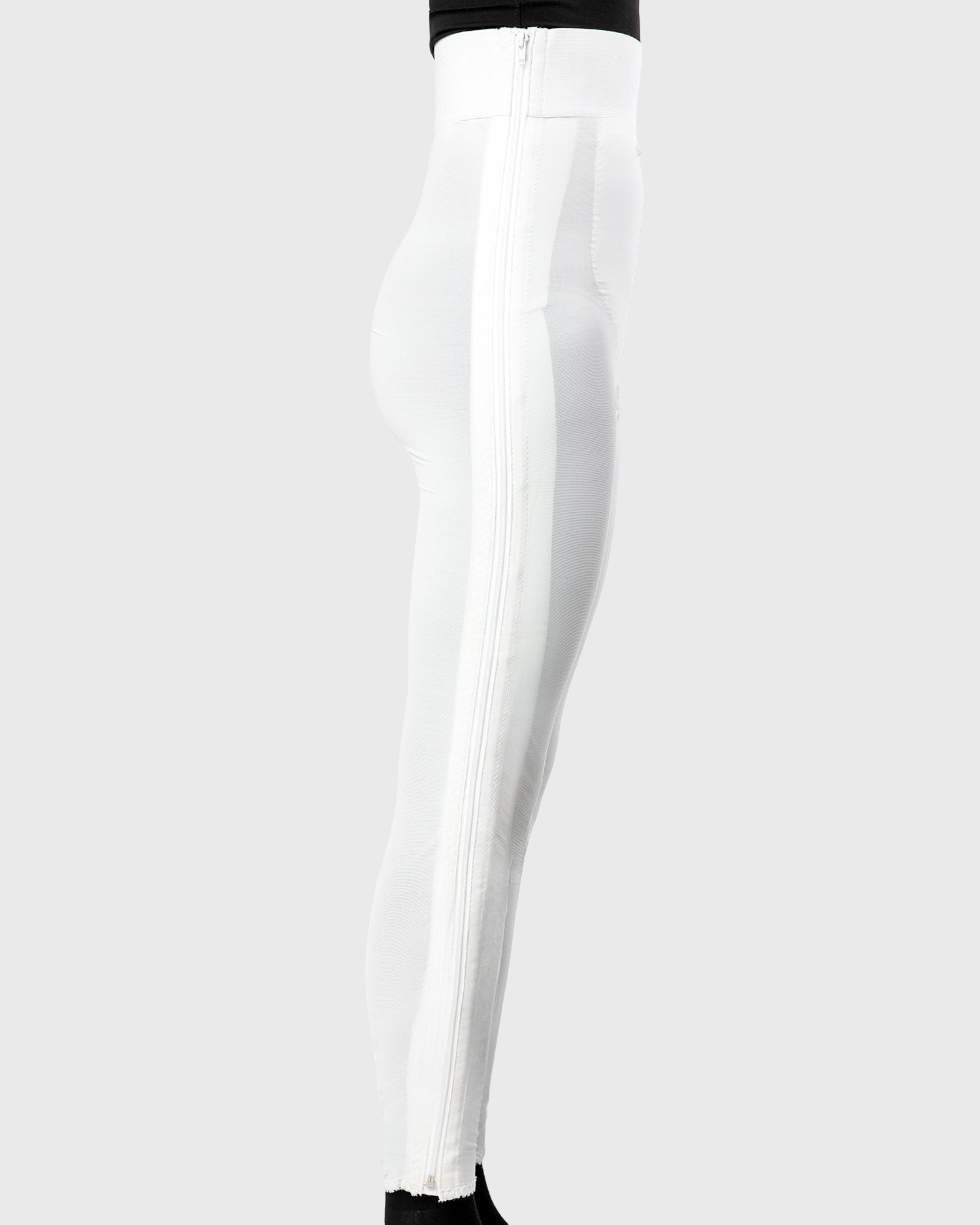 Side view of white high waist ankle length compression girdle with hook and eye closure for complete leg compression