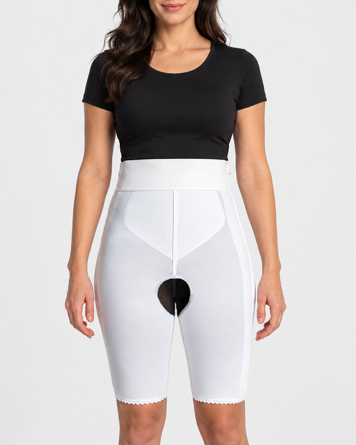 Front view of white above knee compression girdle with contact closure and front zipper for post-surgical recovery