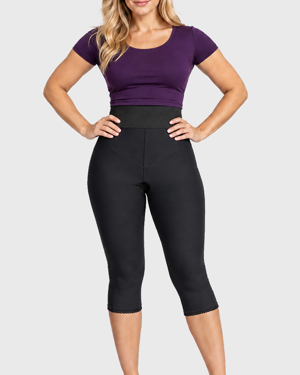 Front view of black below knee compression girdle with contact closure and front zipper for post-surgical recovery