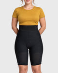 Front view of black above knee compression girdle with hook and eye closure and front zipper for post-surgical recovery