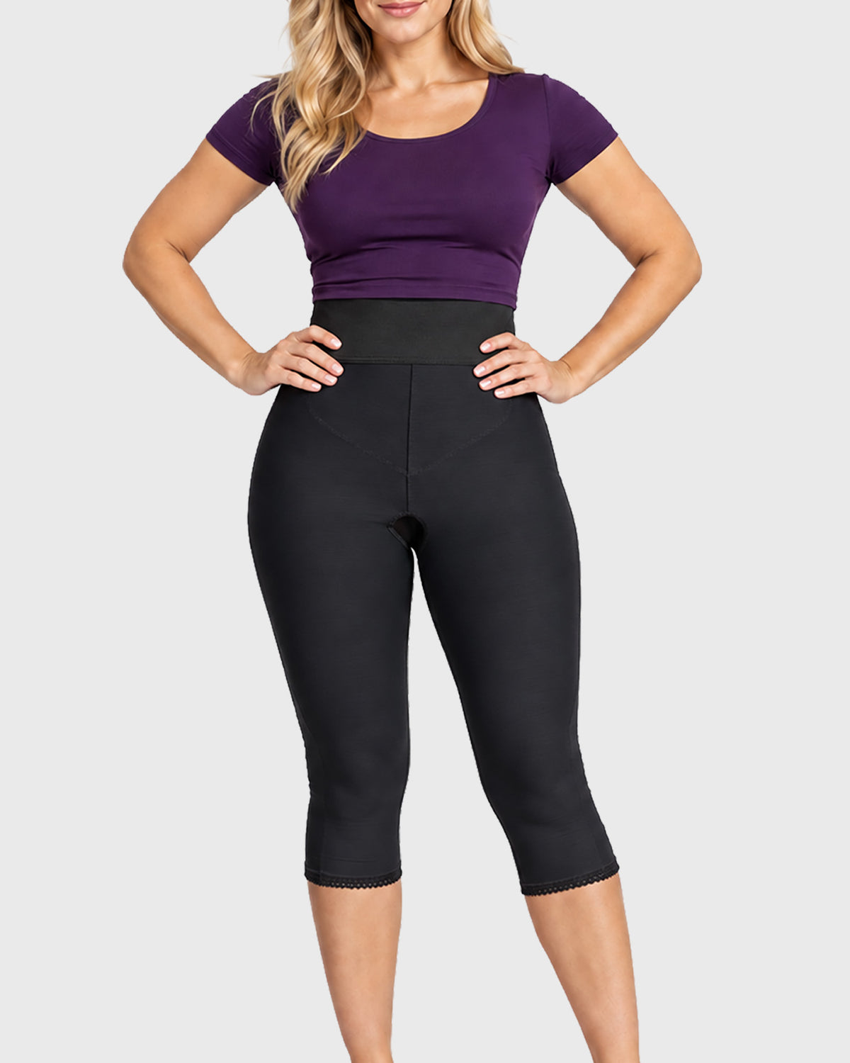 Front view of black below knee compression girdle with hook and eye closure and front zipper for post-surgical recovery