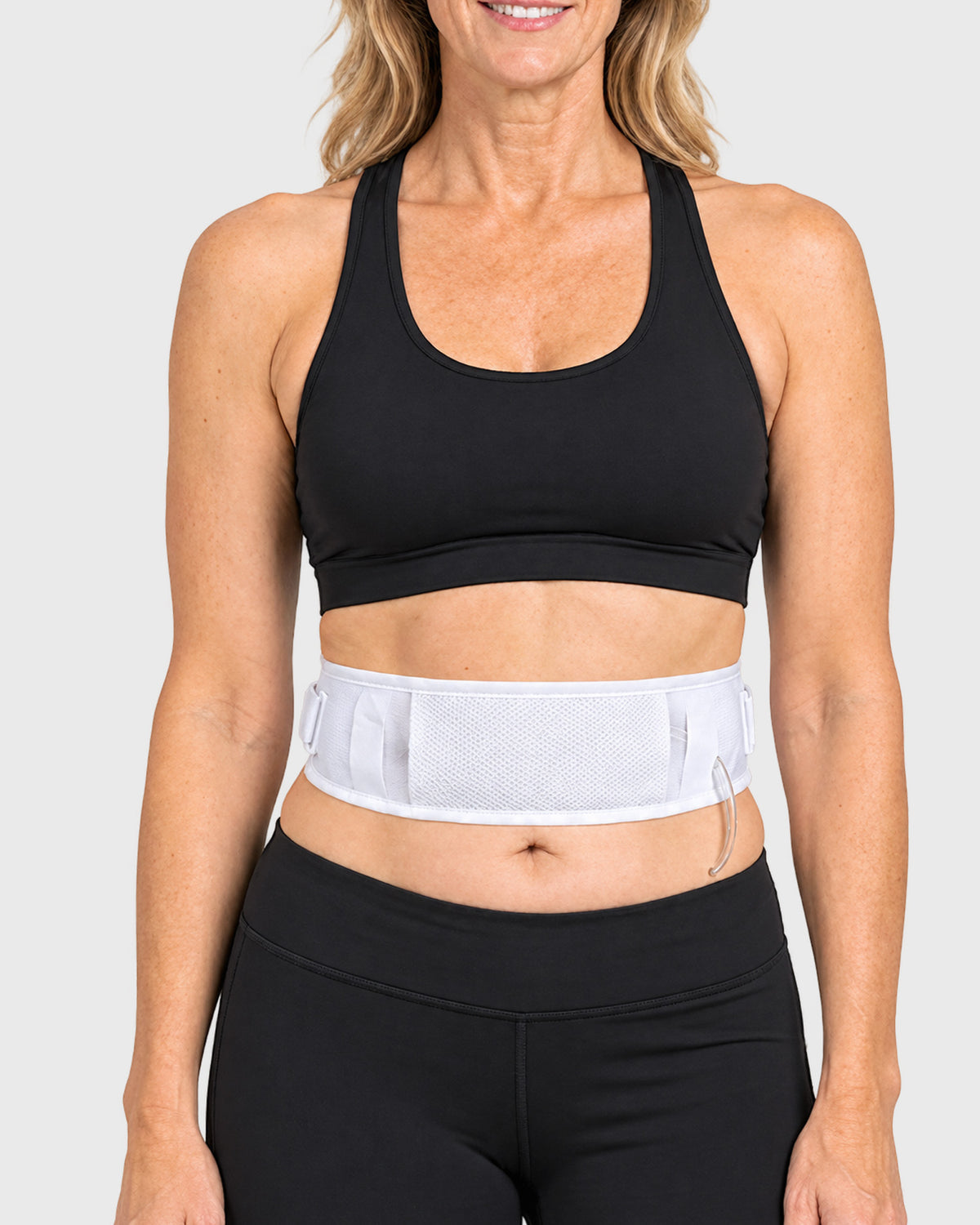 Close-up of white Simple & Secure PD-Belt securing peritoneal dialysis tubing