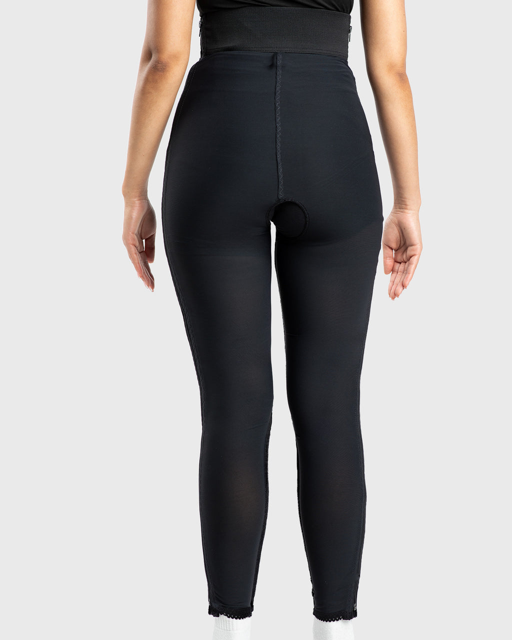Rear view of black high waist ankle length compression girdle with hook and eye closure for surgical compression