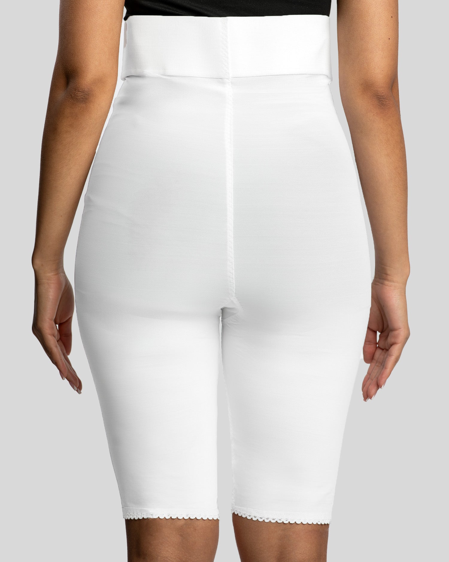 Rear view of white above knee 2nd stage compression girdle for recovery support