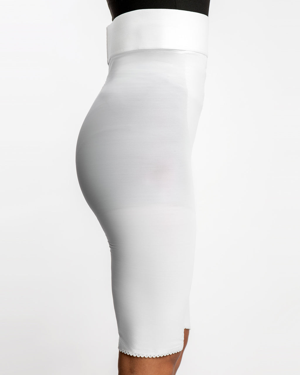 Side view of white above knee 2nd stage compression girdle for continued post-op contouring