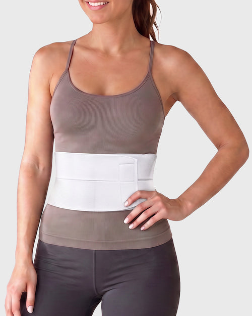 Frank Stubbs Universal 6-Inch Abdominal Binder on female model, front view, providing targeted lower abdominal compression and support