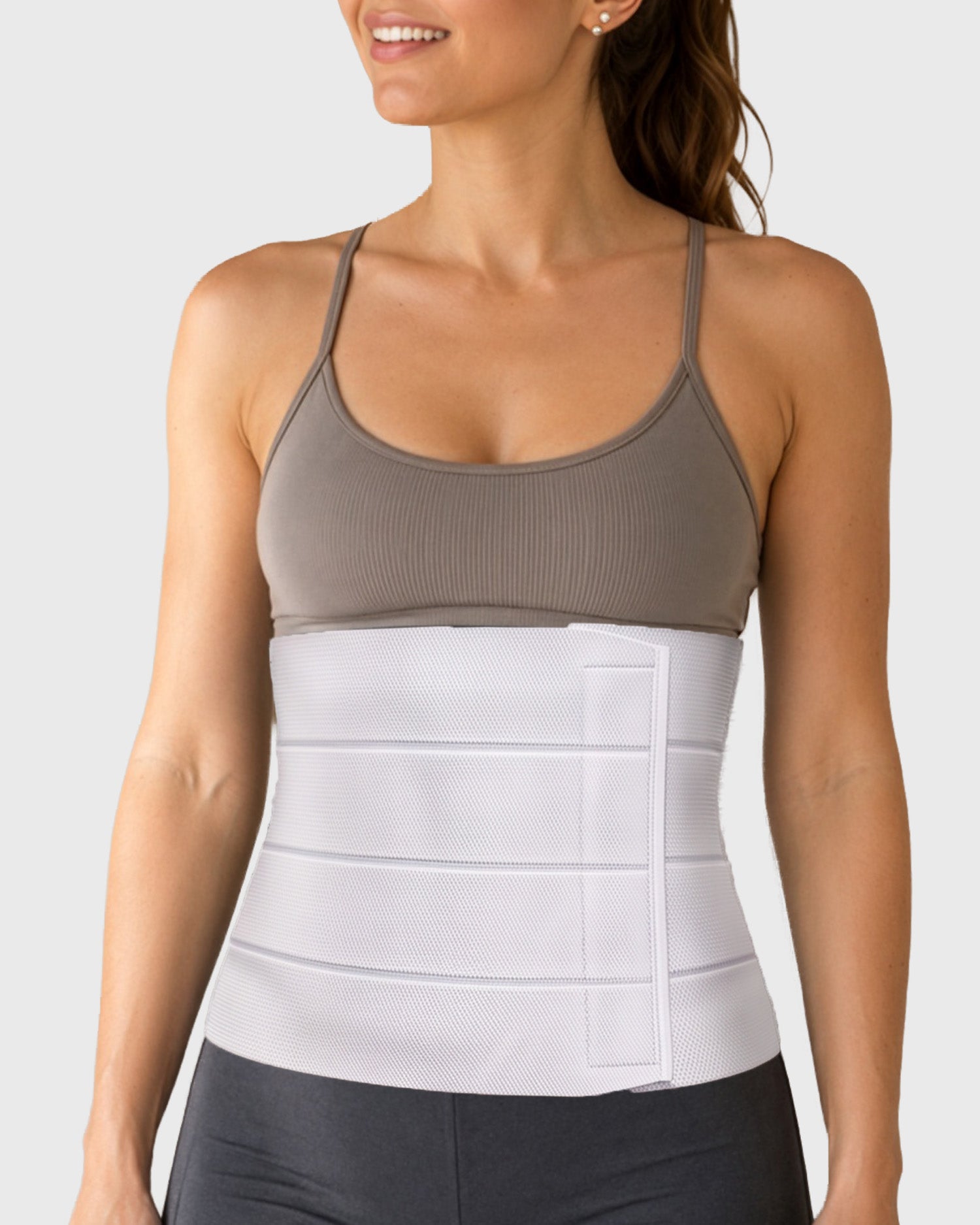 Frank Stubbs Universal 12-Inch Abdominal Binder on female model, front view, providing full abdominal compression and post-surgical support