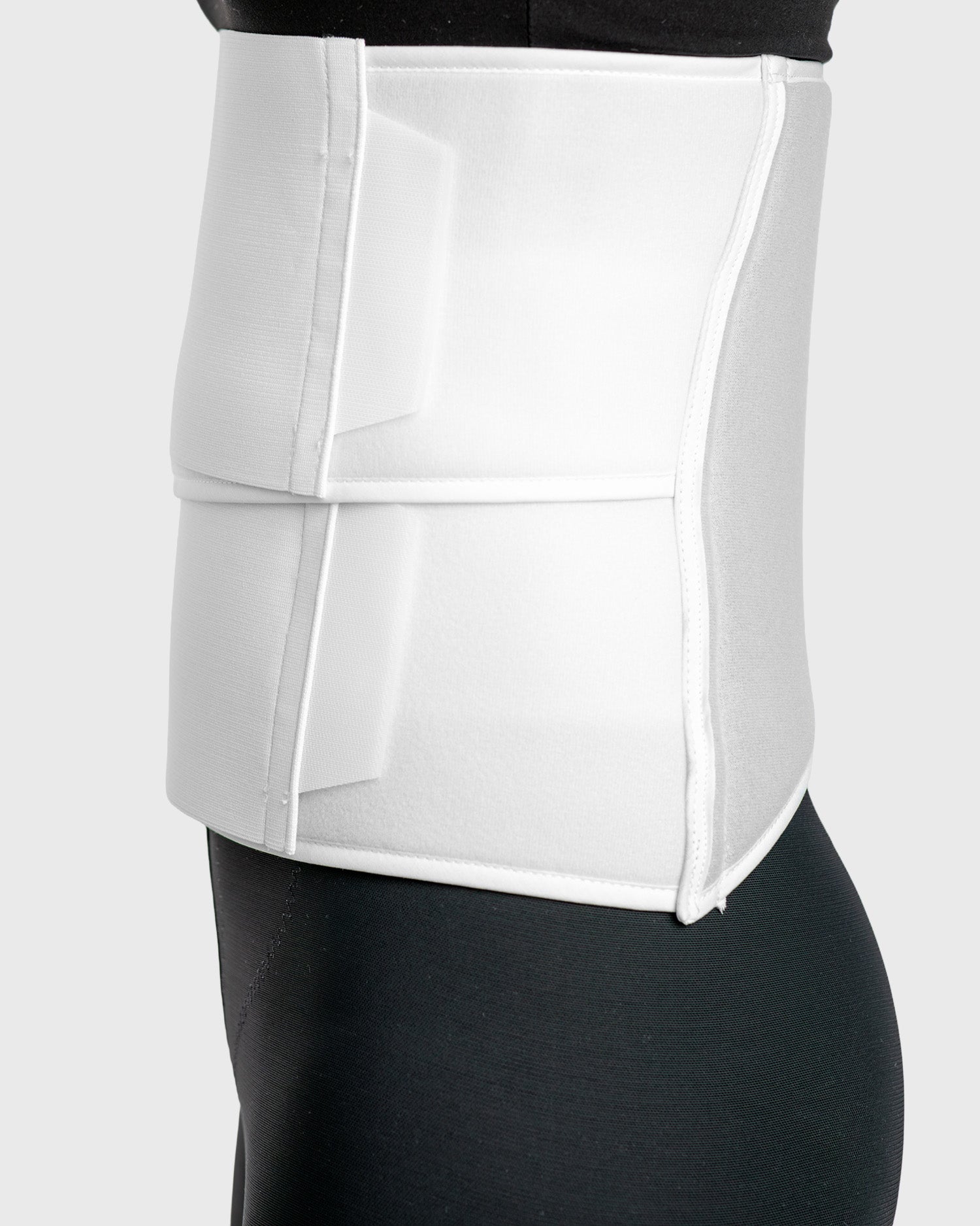 Side view of contoured abdominal binder showing flexible abdominal compression