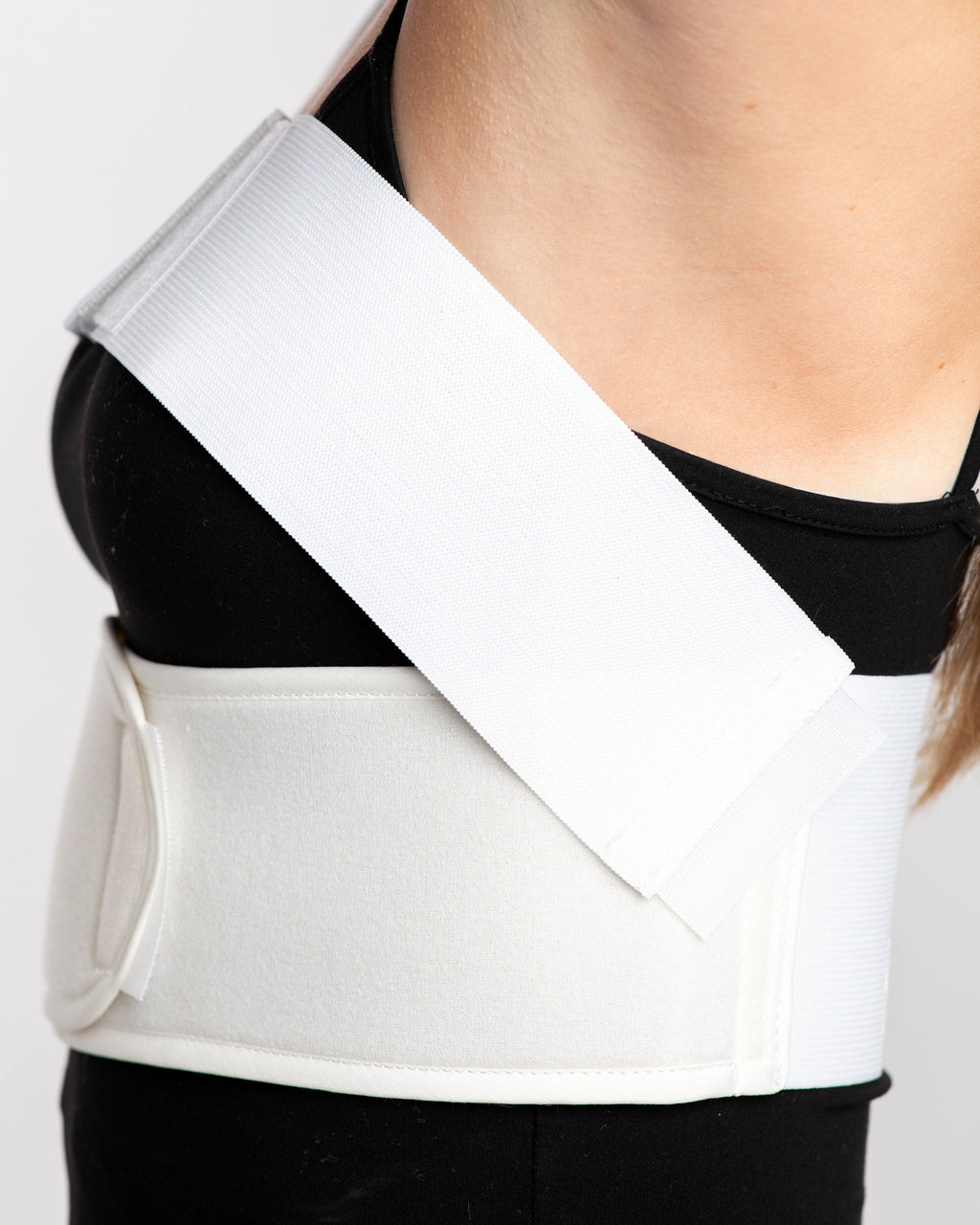 Side view of padded breast augmentation wrap showing upper and lower compression bands