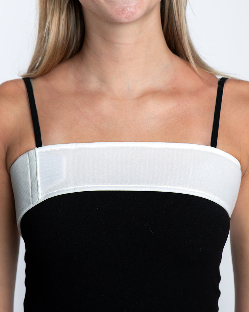 Model wearing universal breast augmentation wrap for implant stabilization