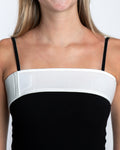 Model wearing universal breast augmentation wrap for implant stabilization