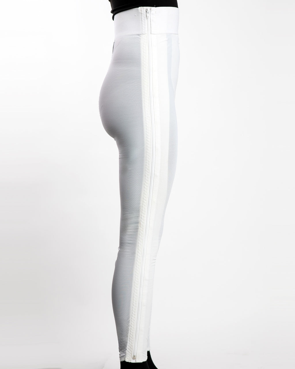 Side view of white high waist ankle length compression girdle with hook and eye closure for complete leg compression