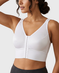 Model wearing white longline compression bra for post-surgical breast support