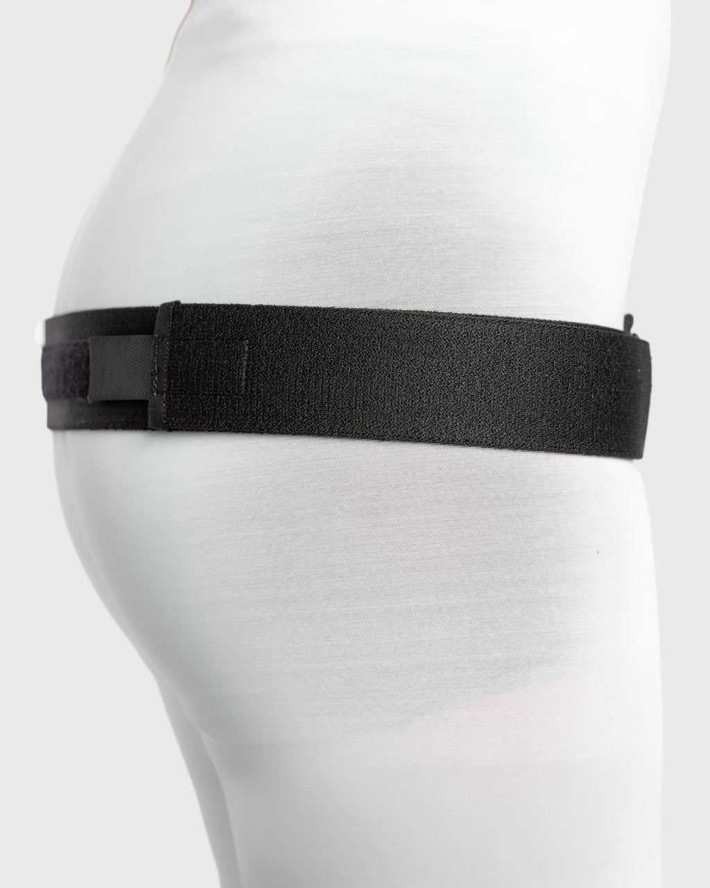 Side view of deluxe trochanter belt featuring adjustable elastic construction and low-profile design for comfortable daily wear