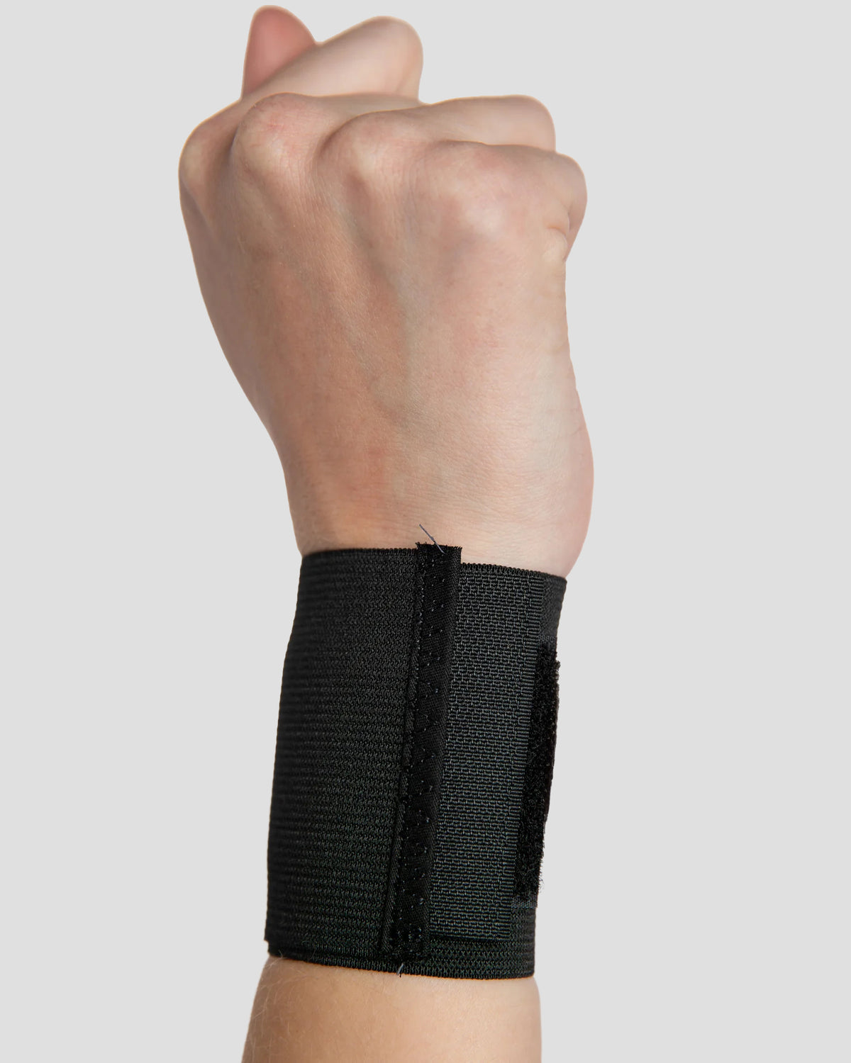 Outside view of elastic wristlet designed to deliver comfortable wrist support during daily activities and recovery