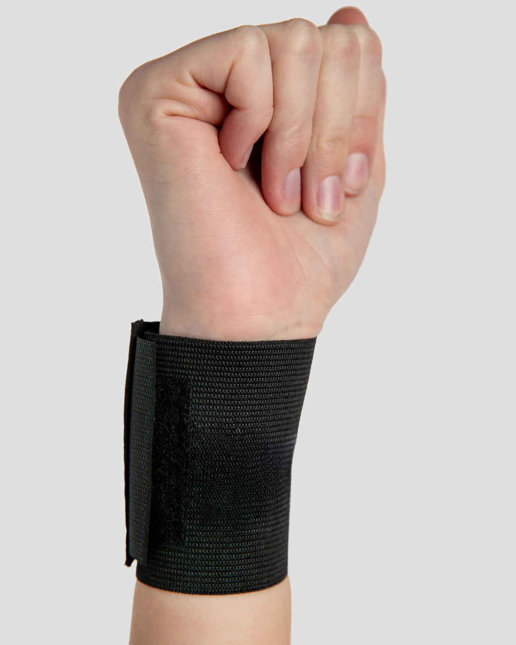 Inside view of elastic wristlet with thumb loop providing light compression and support for weak or injured wrists