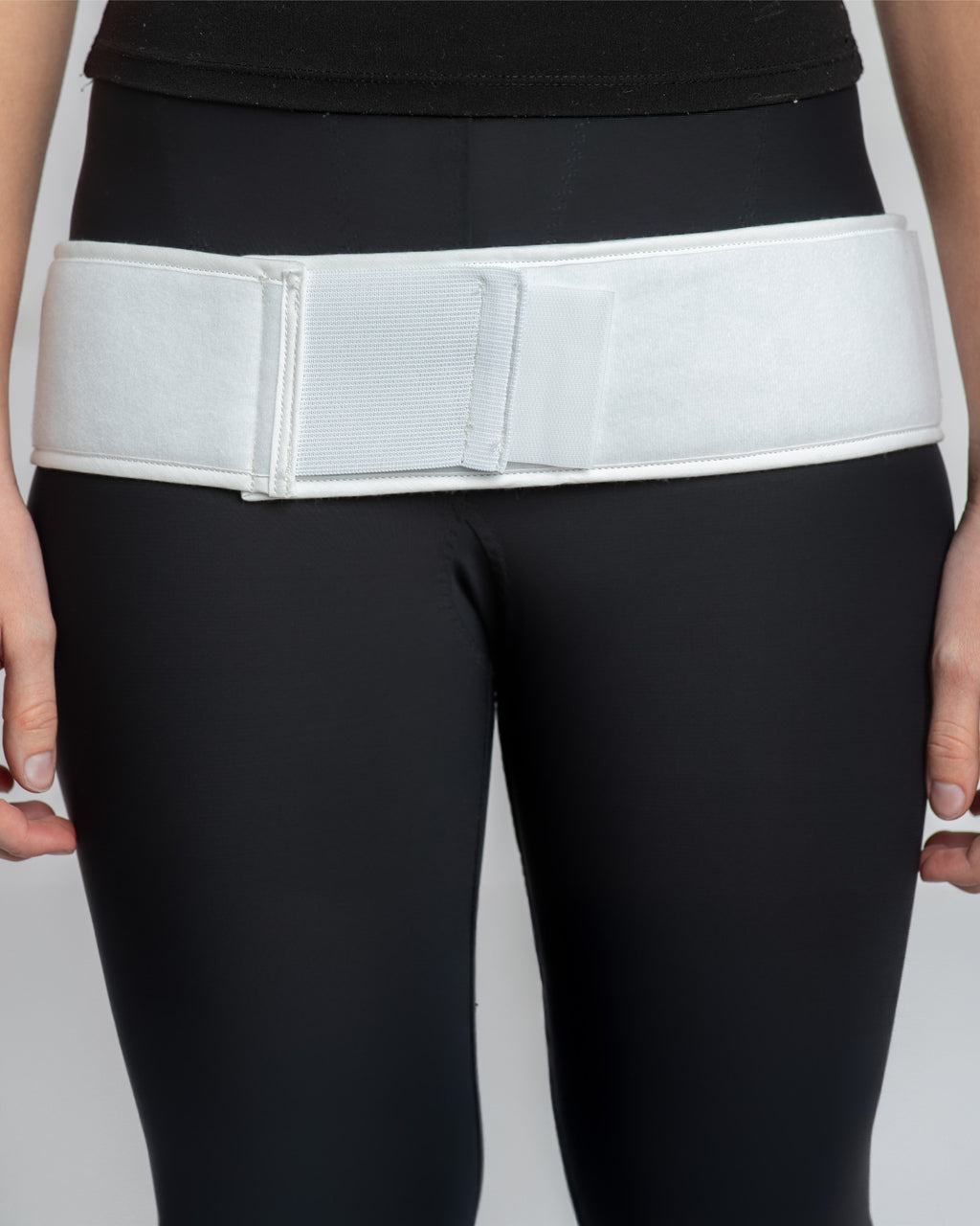 Front view of double pull trochanter belt with adjustable tension straps and padded support for hip dysplasia and pelvic stabilization