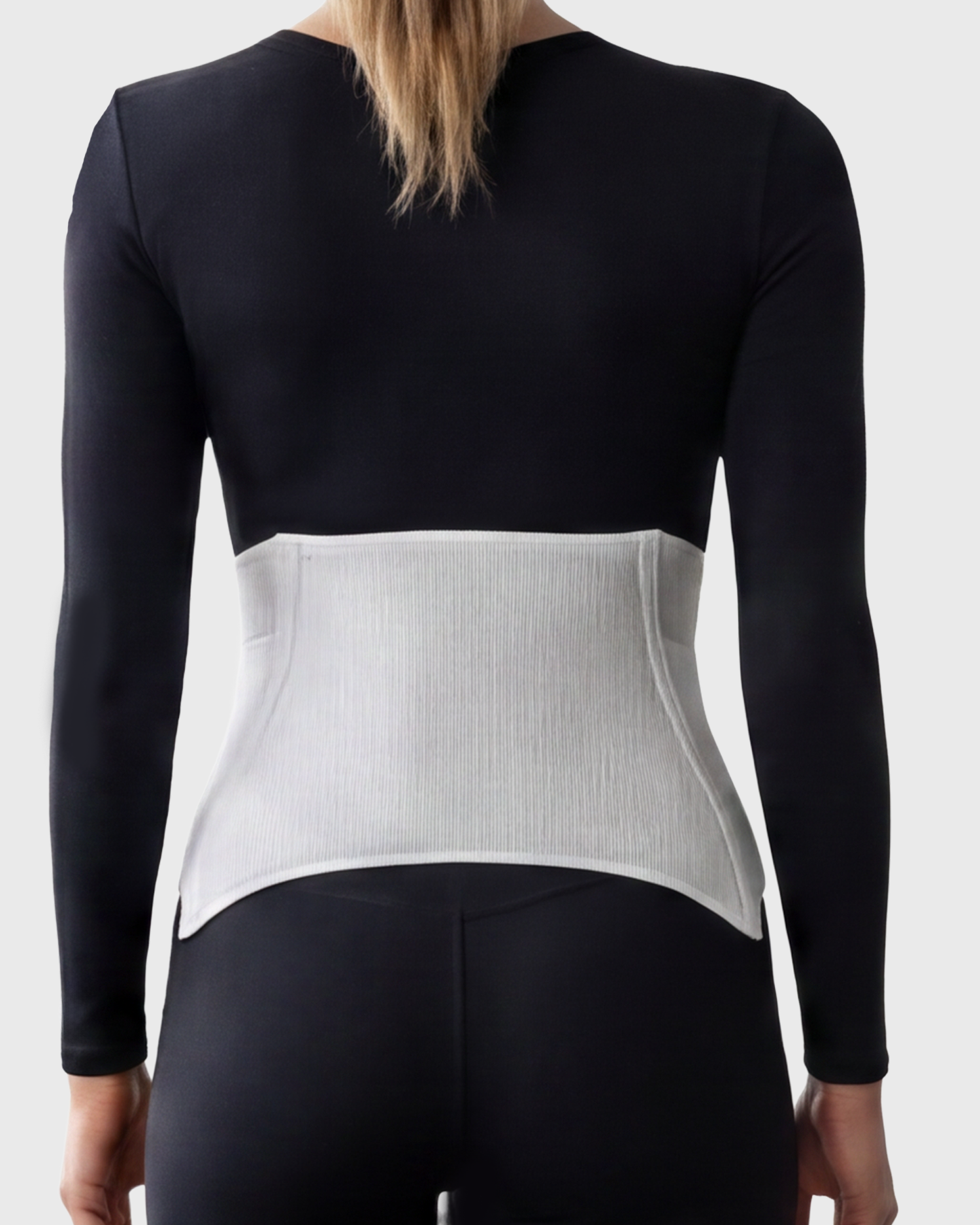 Back view of postpartum contoured abdominal binder featuring a padded support panel with cooling cut-out design for comfortable postpartum abdominal support and recovery.